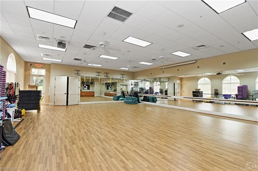 970 Egrets Run, Unit 201 Naples, FL 34108 - Photo 49 of 50 a large room with gym equipment