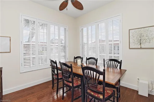 a view of a a dining room with furniture window and wooden floor