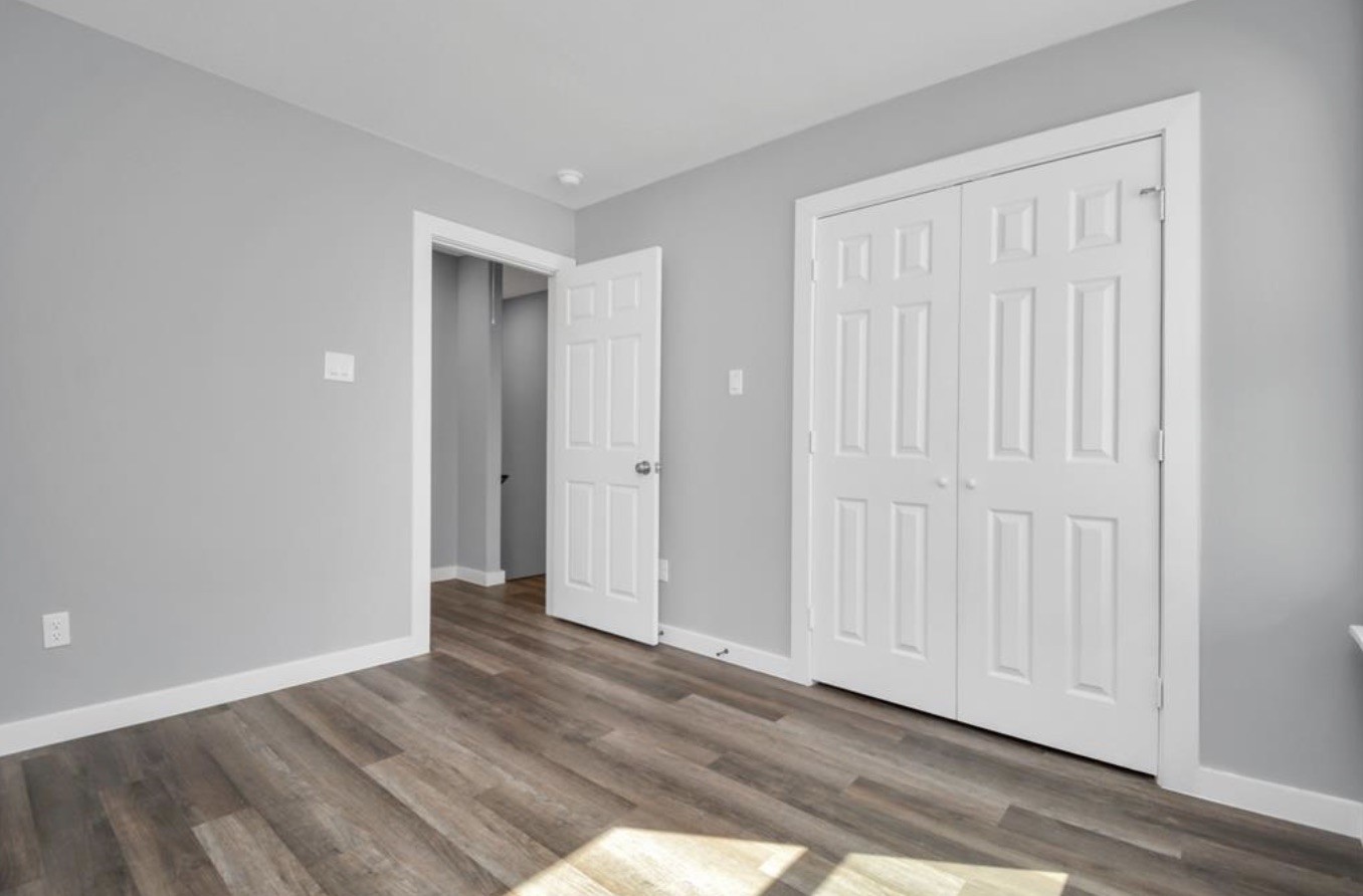 5709 Breland Street, Unit A Houston, TX 77016 - Photo 12 of 26 a view of an empty room with wooden floor