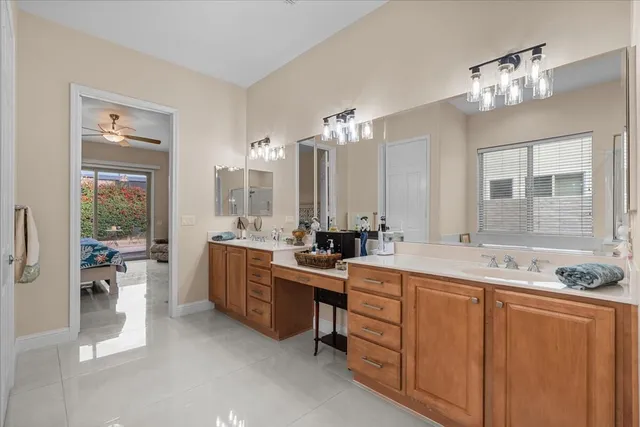 a bathroom with a double vanity sink and a mirror