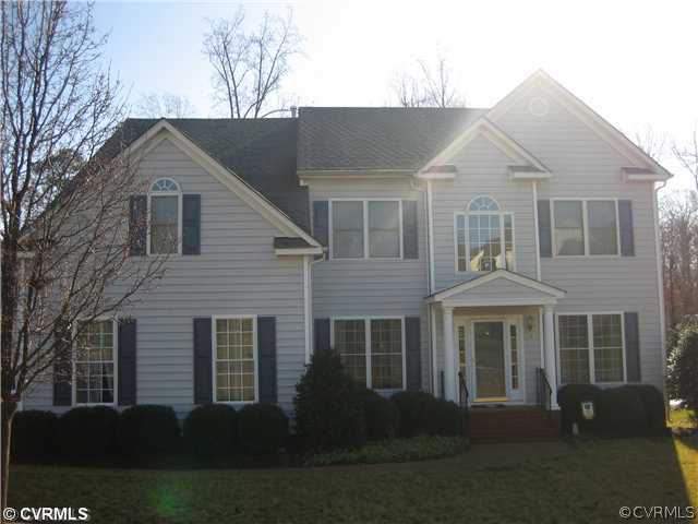 1307 Goswick Ridge Road Midlothian, VA 23114 - Photo 1 of 12 a front view of a house with a yard