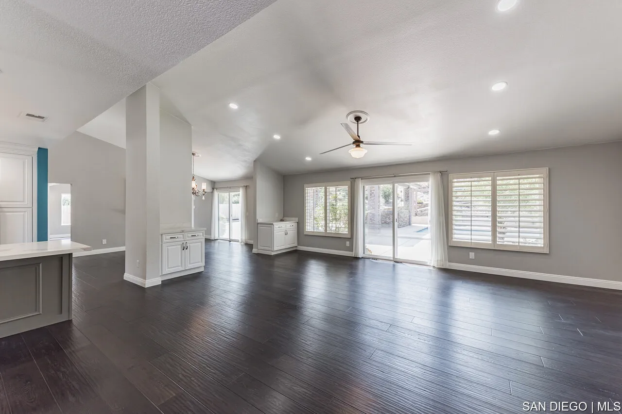 14001 Painted Desert Road Poway, CA 92064 - Photo 9 of 40 an empty room with wooden floor and windows