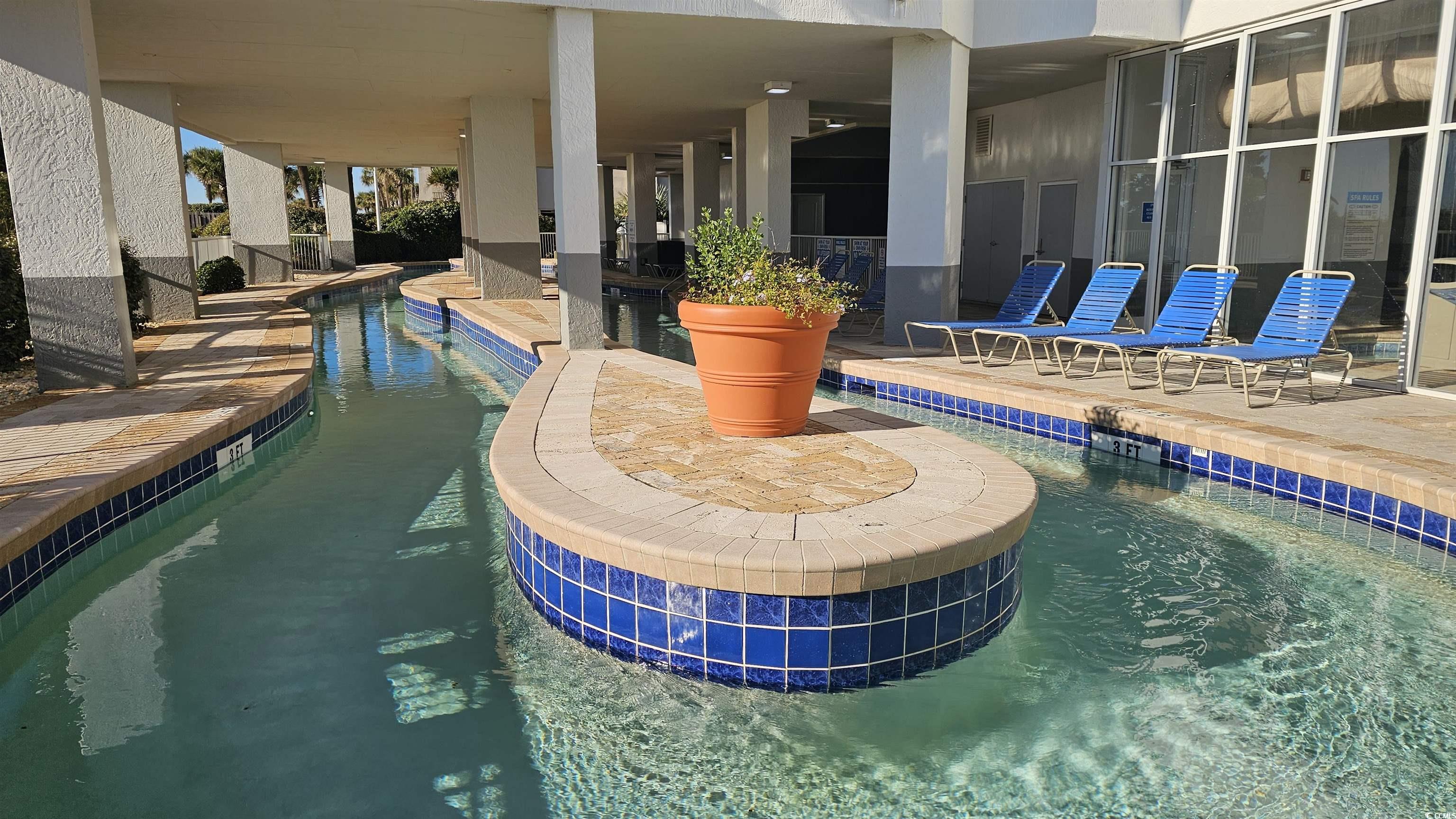 161 Seawatch Drive, Unit 610 Myrtle Beach, SC 29572 - Photo 18 of 35 Community pool featuring a patio and a hot tub
