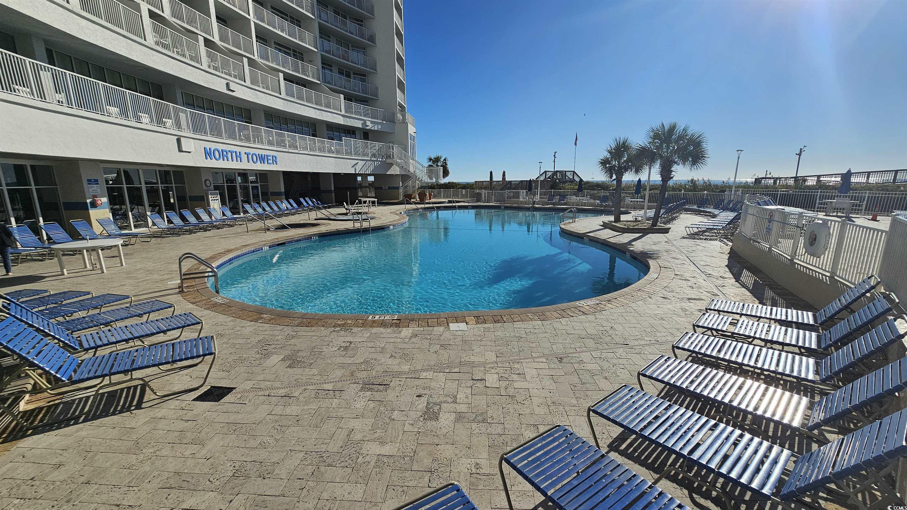 161 Seawatch Drive, Unit 610 Myrtle Beach, SC 29572 - Photo 26 of 35 Community pool with a patio