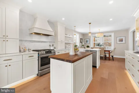 a kitchen that has a cabinets and a stove