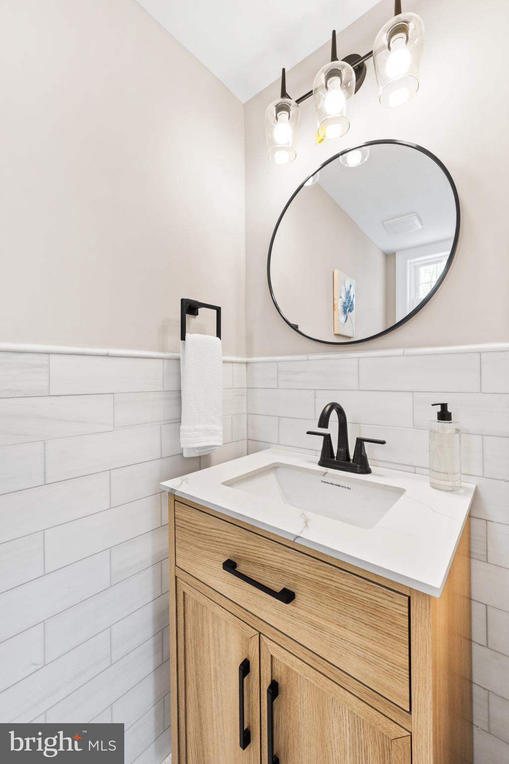 466 St Davids Avenue Wayne, PA 19087 - Photo 19 of 42 a bathroom with a sink and a mirror