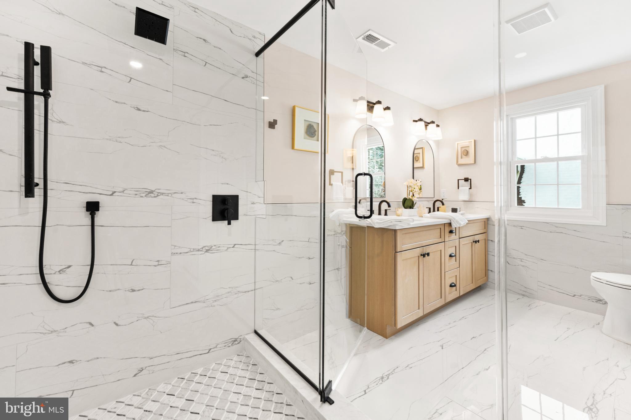 466 St Davids Avenue Wayne, PA 19087 - Photo 26 of 41 a bathroom with a double vanity sink a toilet and shower