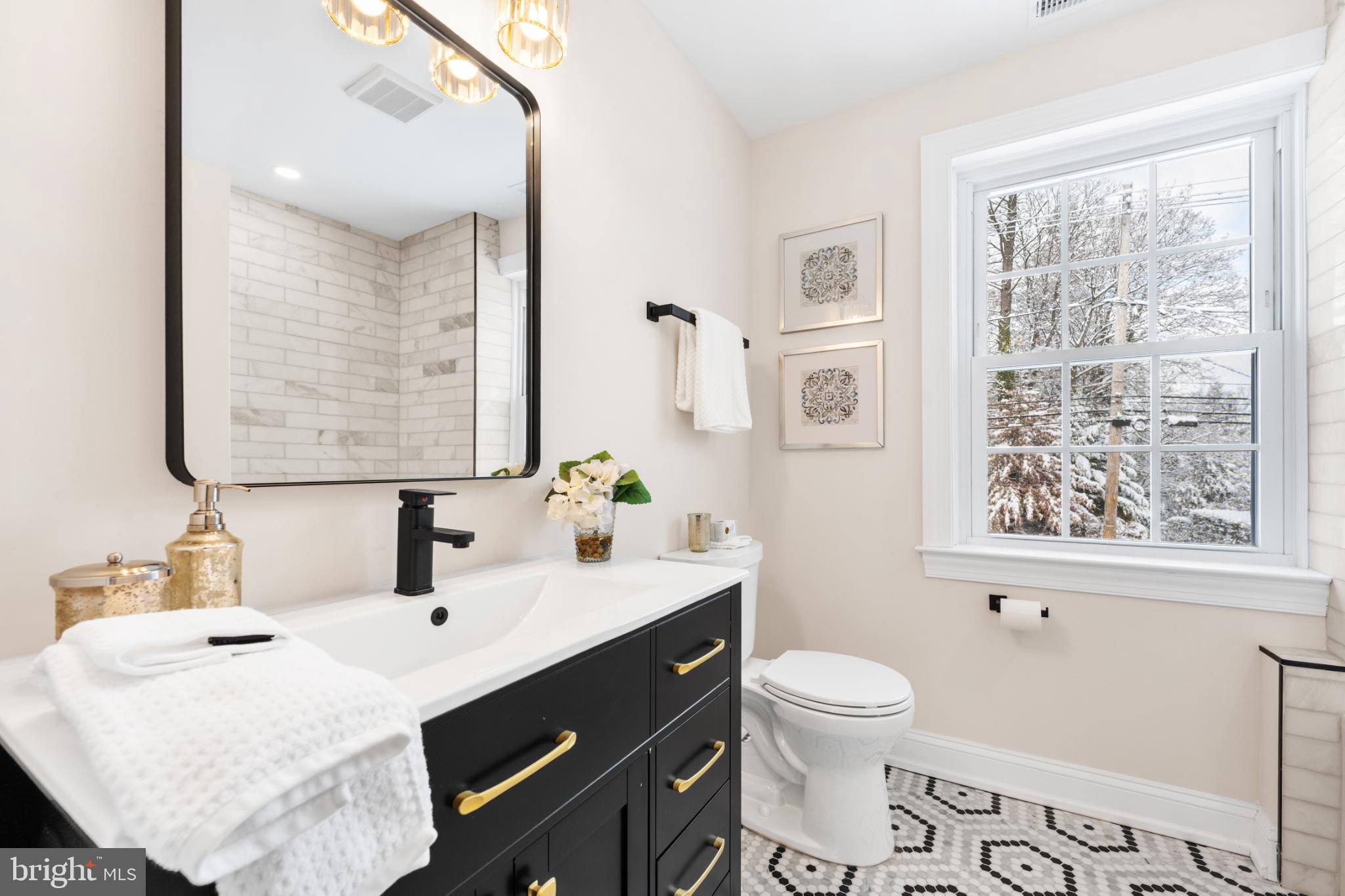 466 St Davids Avenue Wayne, PA 19087 - Photo 32 of 42 a bathroom with a sink vanity granite toilet and a mirror