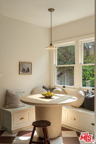 a kitchen with granite countertop a stove and a refrigerator