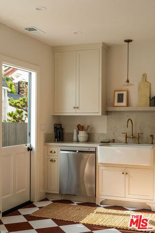 a bedroom with bed and a couch