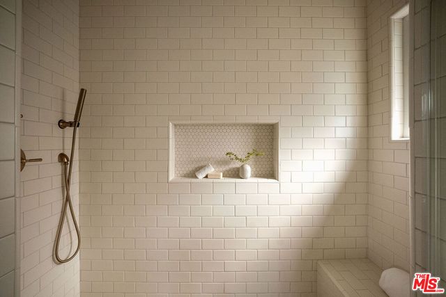 a bathroom with a sink and a shower