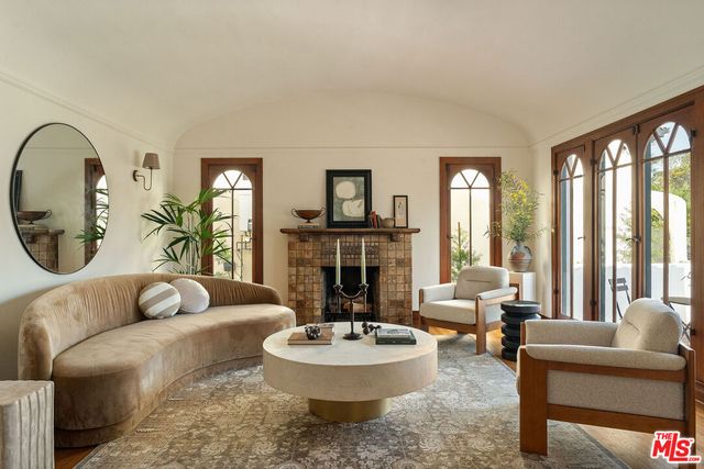 a view of a dining room with furniture wooden floor livingroom and chandelier