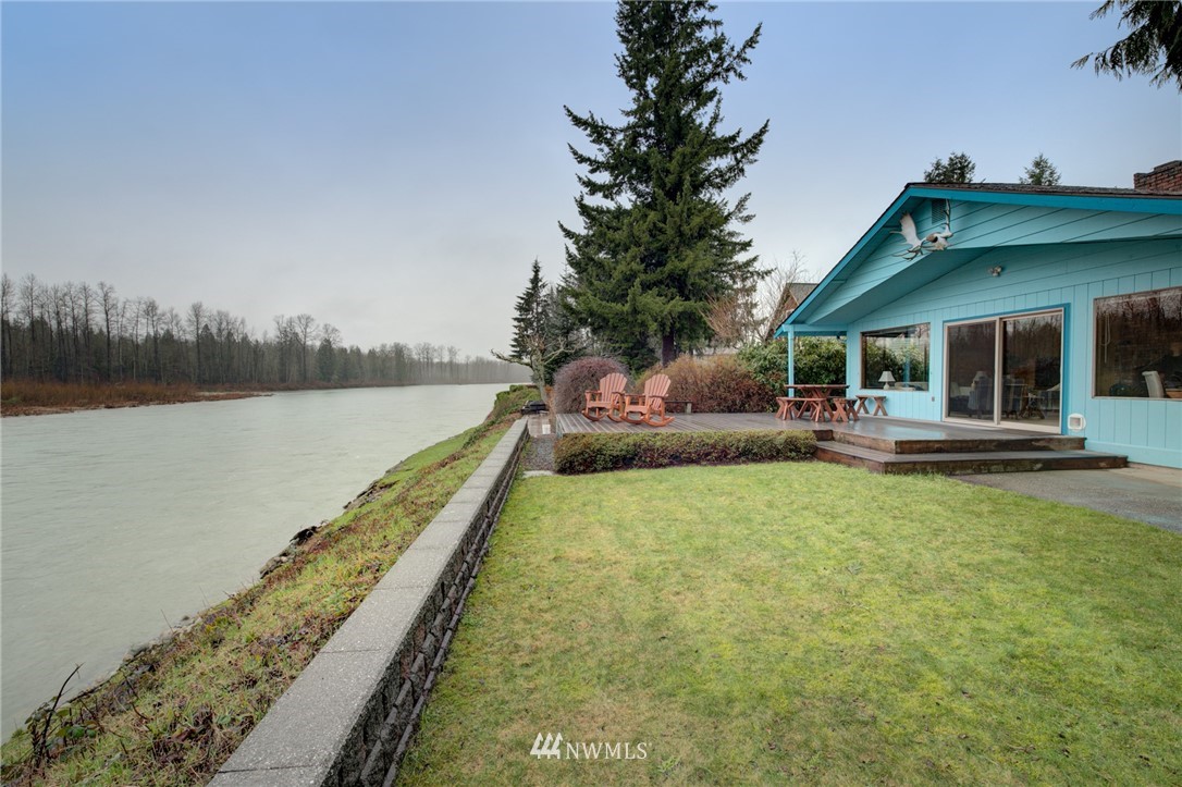 1104 Dyer Road Sultan, WA 98294 - Photo 14 of 40 a view of a house with swimming pool and sitting area
