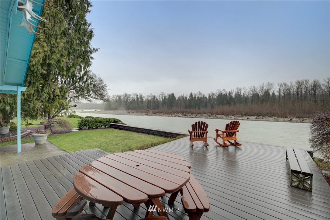 1104 Dyer Road Sultan, WA 98294 - Photo 17 of 40 a view of a lake with table and chairs
