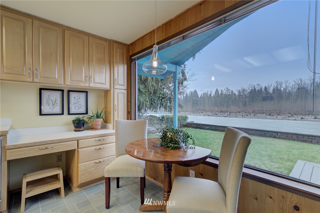 1104 Dyer Road Sultan, WA 98294 - Photo 3 of 40 a dining room with furniture and a floor to ceiling window