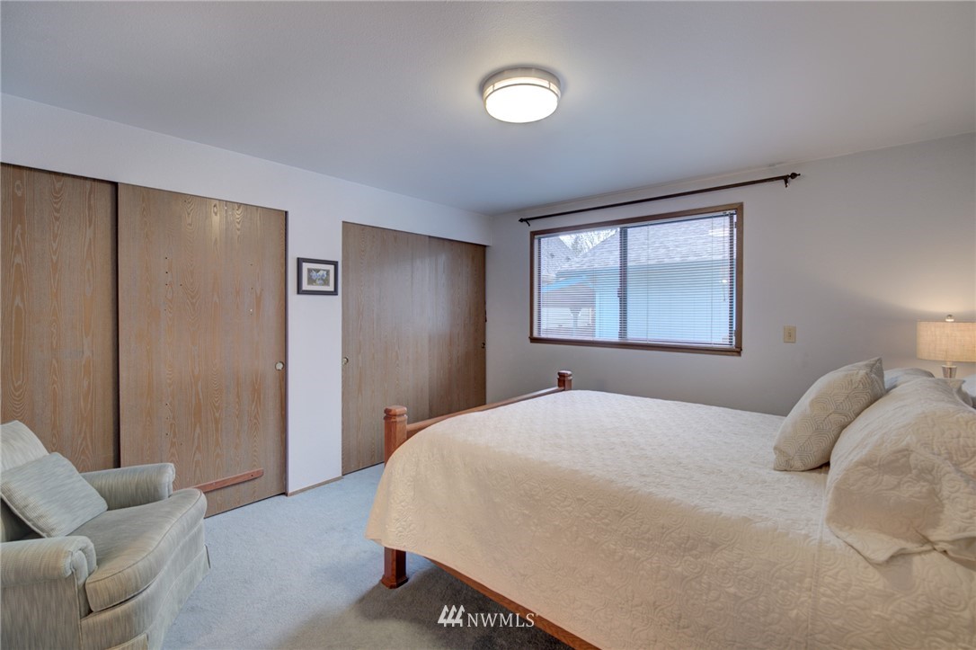 1104 Dyer Road Sultan, WA 98294 - Photo 23 of 40 a bedroom with a bed and a couch