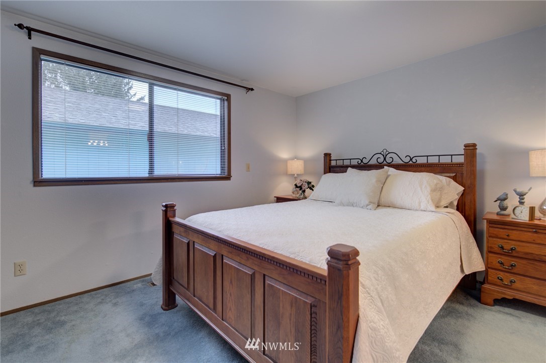 1104 Dyer Road Sultan, WA 98294 - Photo 24 of 40 a bedroom with a bed and a window