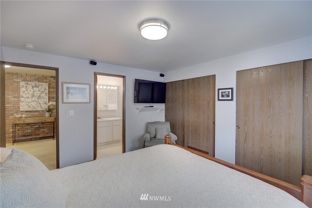 1104 Dyer Road Sultan, WA 98294 - Photo 26 of 40 a bedroom with a bed and a view of kitchen