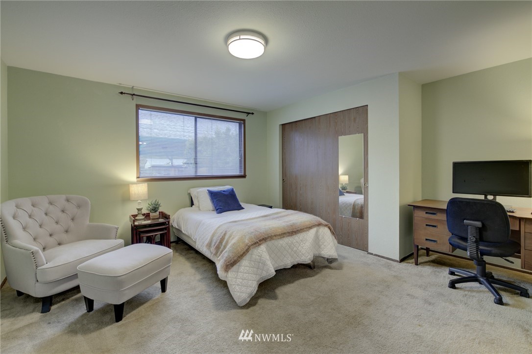 1104 Dyer Road Sultan, WA 98294 - Photo 28 of 40 a bedroom with a bed and a couch