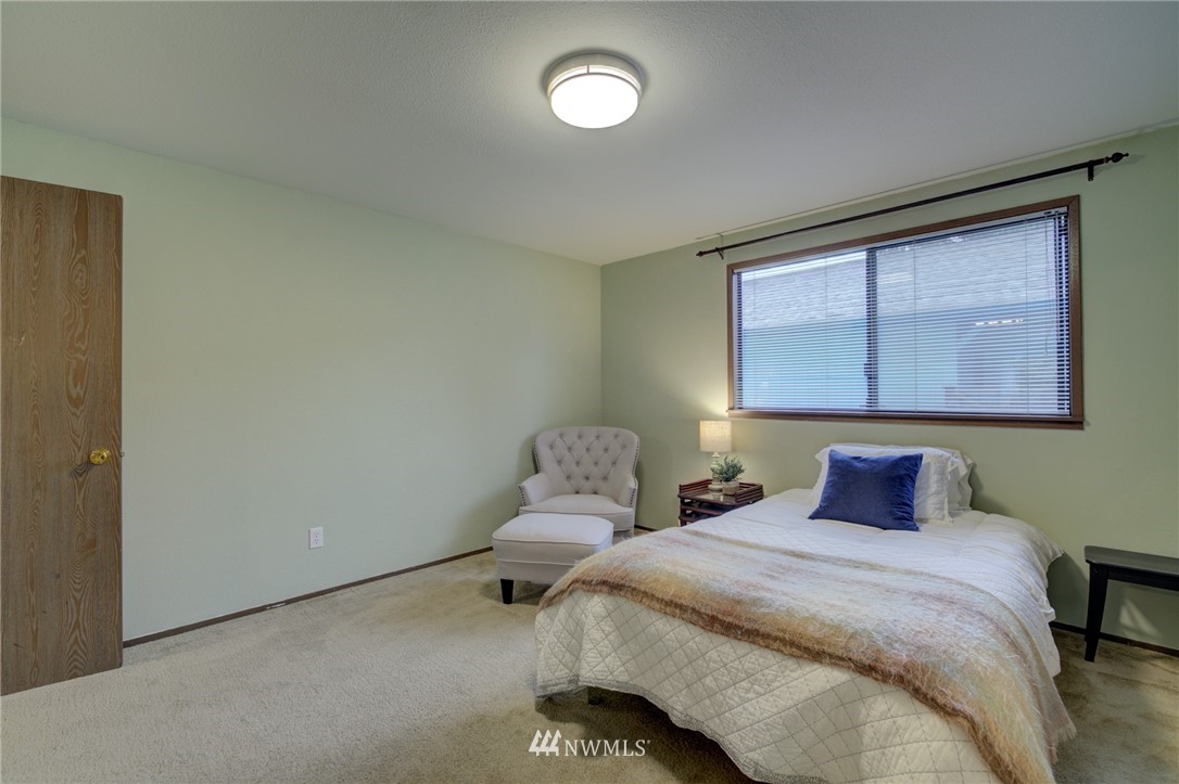 1104 Dyer Road Sultan, WA 98294 - Photo 29 of 40 a bedroom with a bed and window