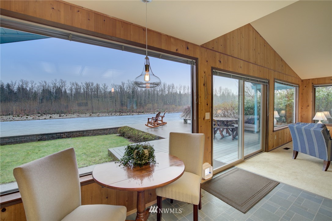 1104 Dyer Road Sultan, WA 98294 - Photo 4 of 40 a view of a dining room with furniture window and wooden floor