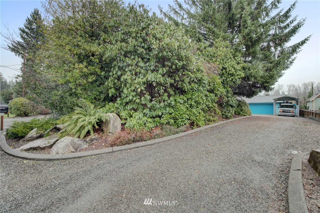 1104 Dyer Road Sultan, WA 98294 - Photo 35 of 40 a view of a road with a bench in roof