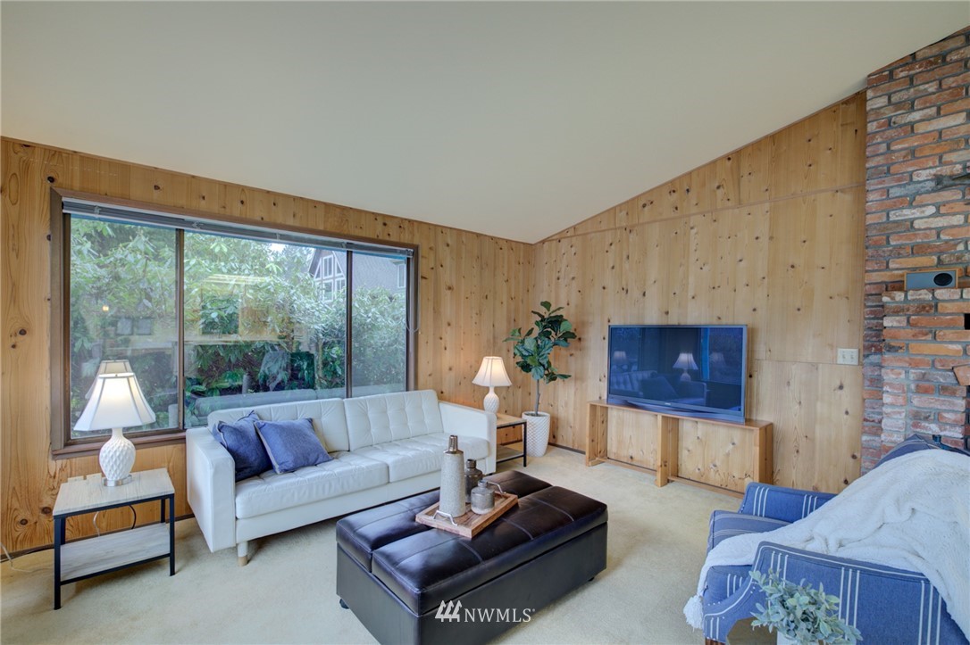 1104 Dyer Road Sultan, WA 98294 - Photo 6 of 40 a living room with furniture and a floor to ceiling window