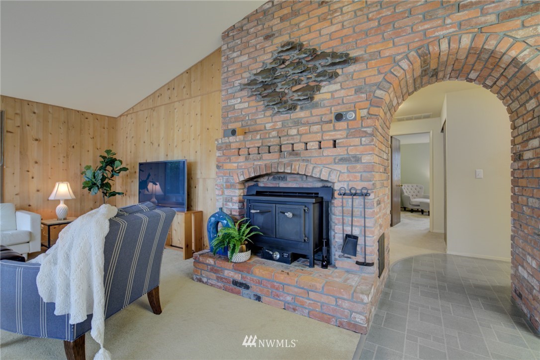 1104 Dyer Road Sultan, WA 98294 - Photo 8 of 40 a living room with furniture and a fireplace