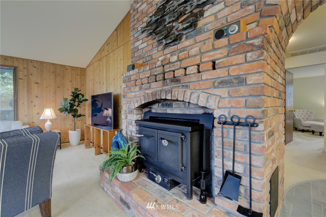 1104 Dyer Road Sultan, WA 98294 - Photo 9 of 40 a living room filled with furniture and a fireplace