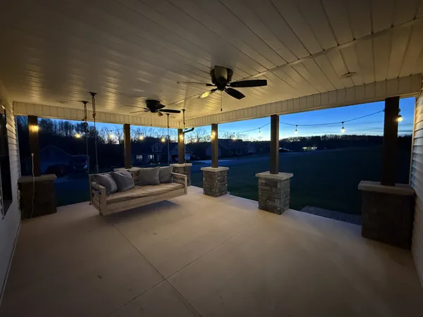a view of kitchen with dining table and chairs