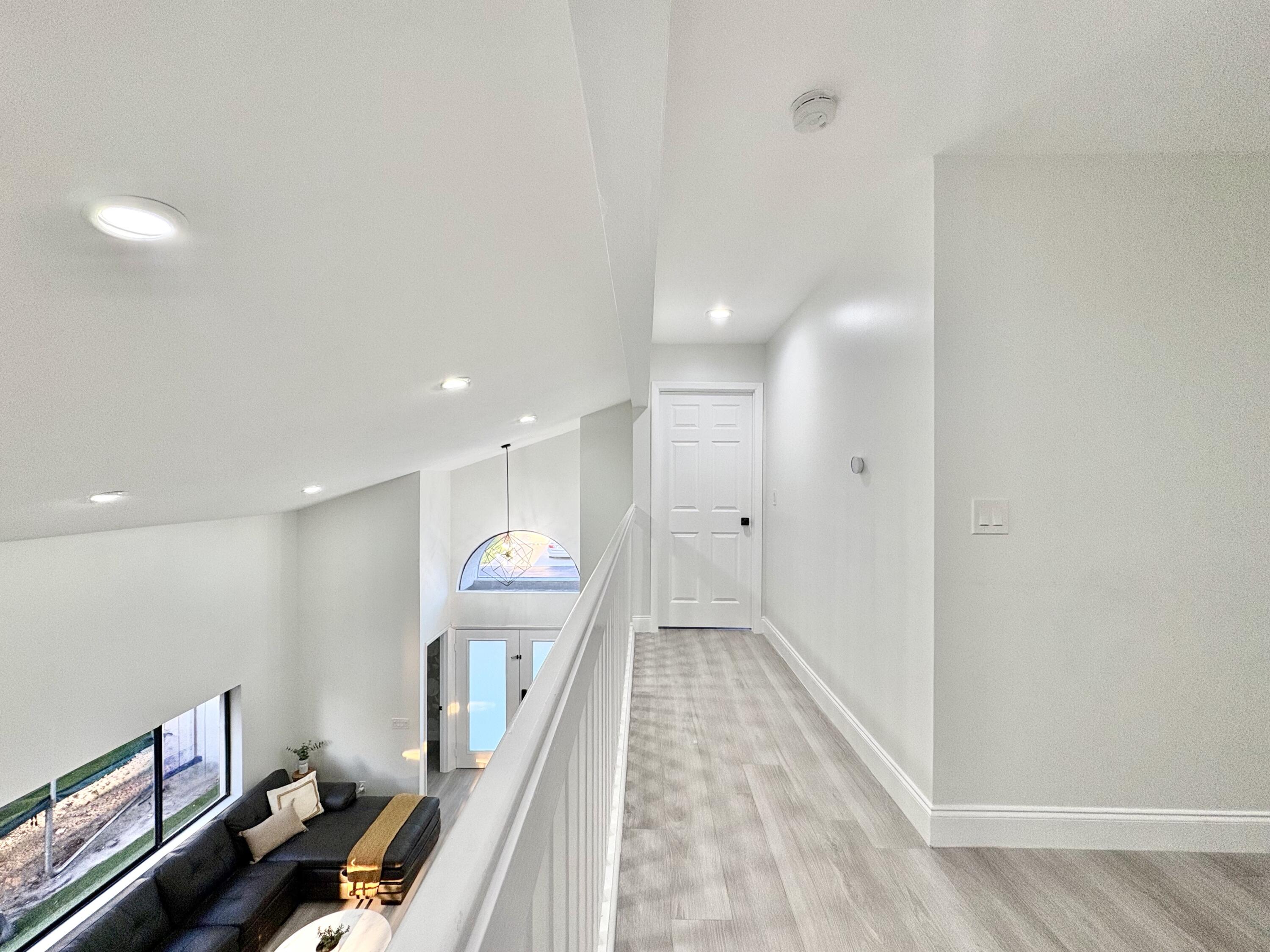 3 Kyle Way Boynton Beach, FL 33426 - Photo 13 of 36 a view of a hallway with wooden floor