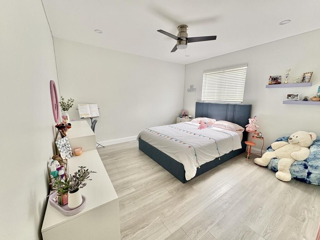 3 Kyle Way Boynton Beach, FL 33426 - Photo 15 of 36 a bedroom with a bed and a dresser