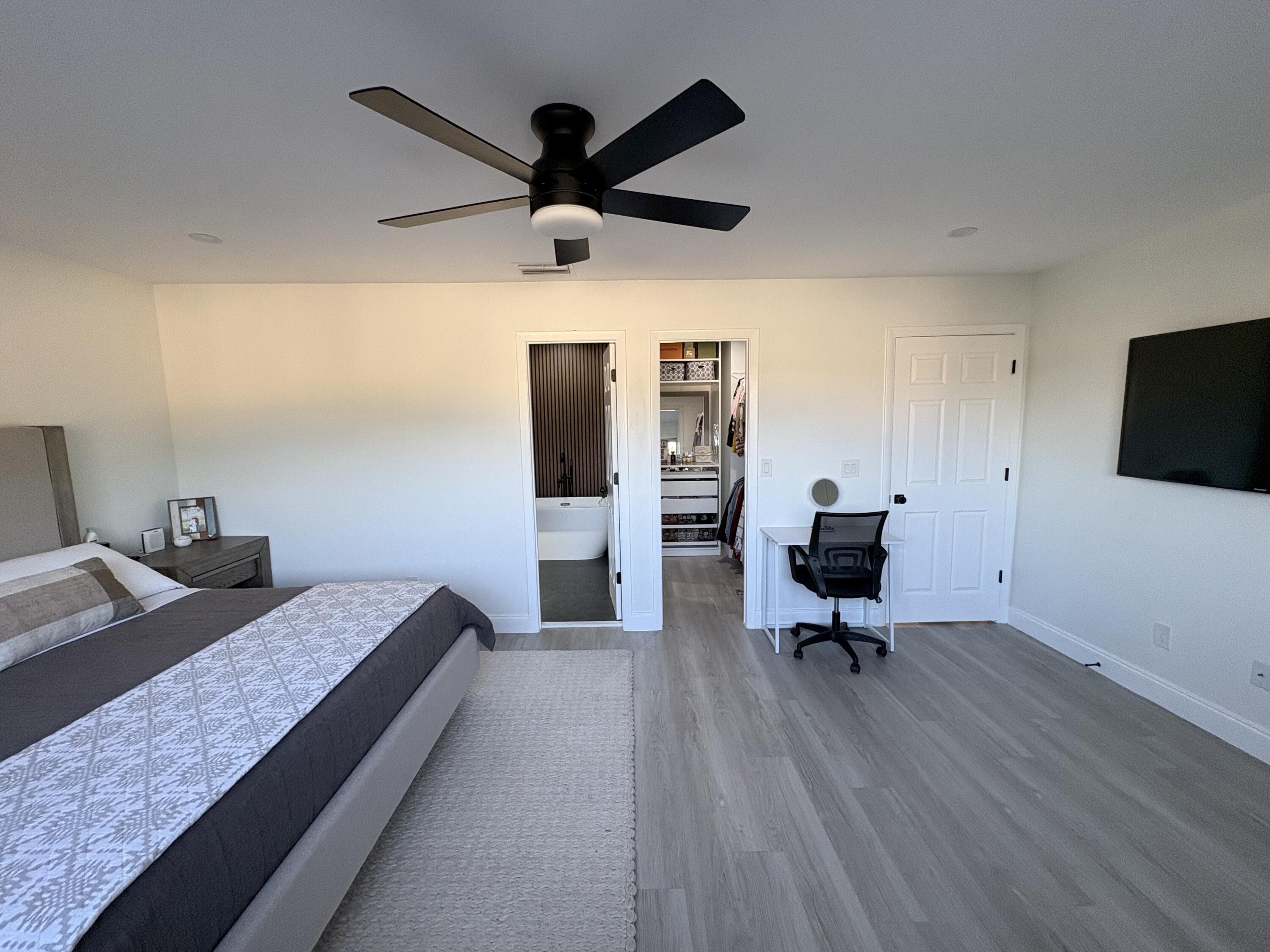 3 Kyle Way Boynton Beach, FL 33426 - Photo 21 of 36 a bed room with a bed furniture and a ceiling fan