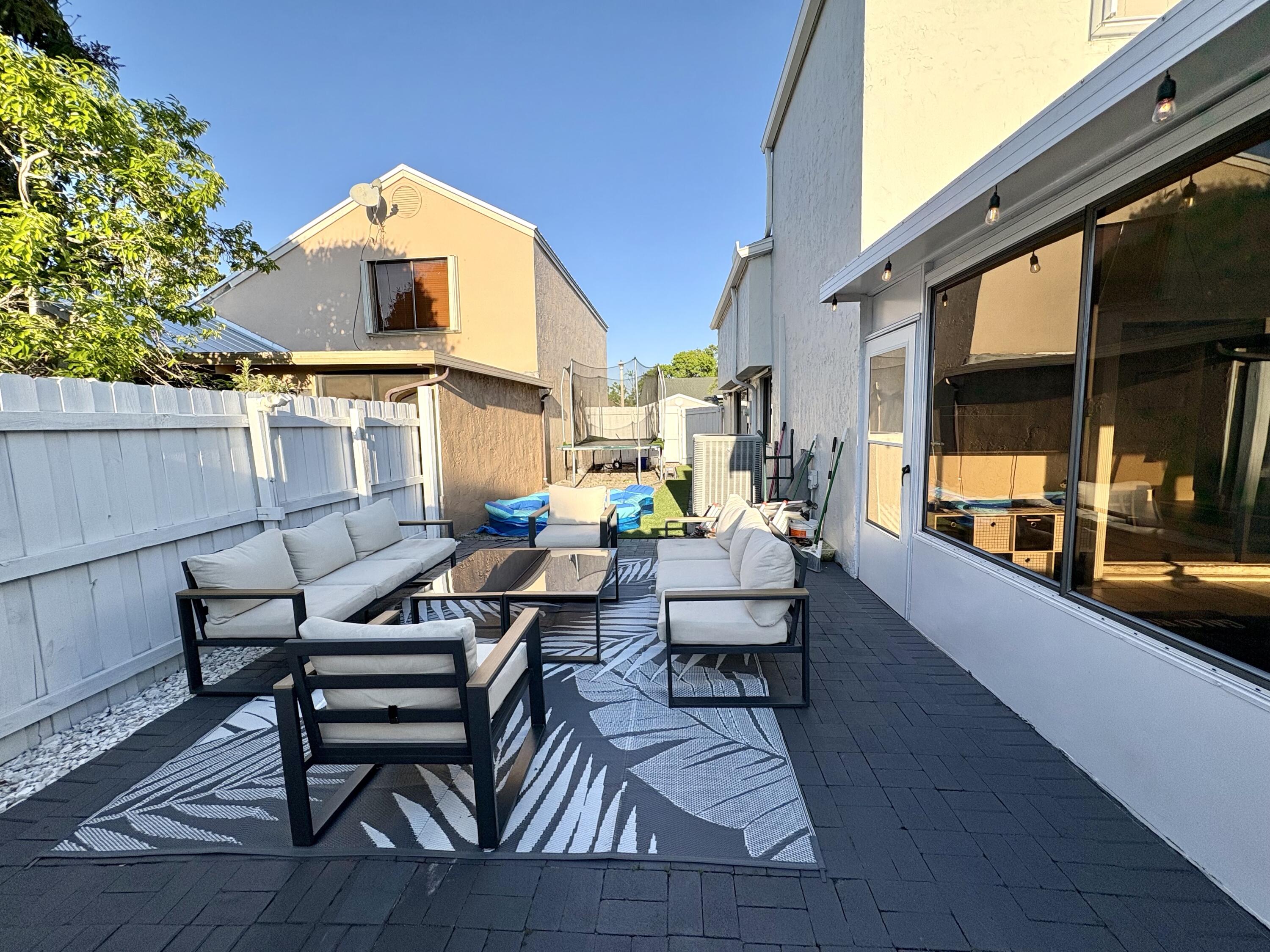 3 Kyle Way Boynton Beach, FL 33426 - Photo 33 of 36 a view of a outdoor seating area with furniture