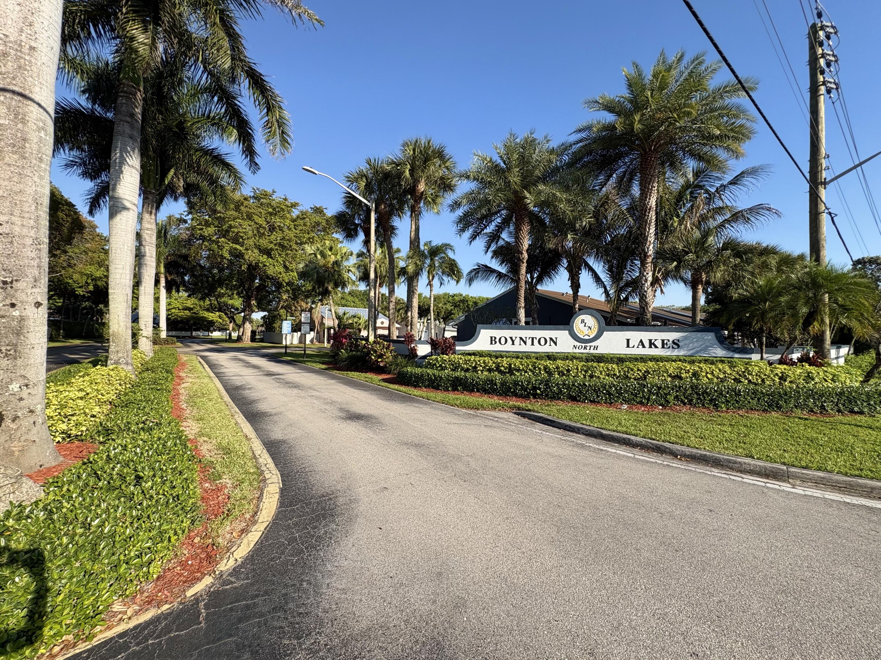 3 Kyle Way Boynton Beach, FL 33426 - Photo 34 of 36 a view of a swimming pool with palm trees