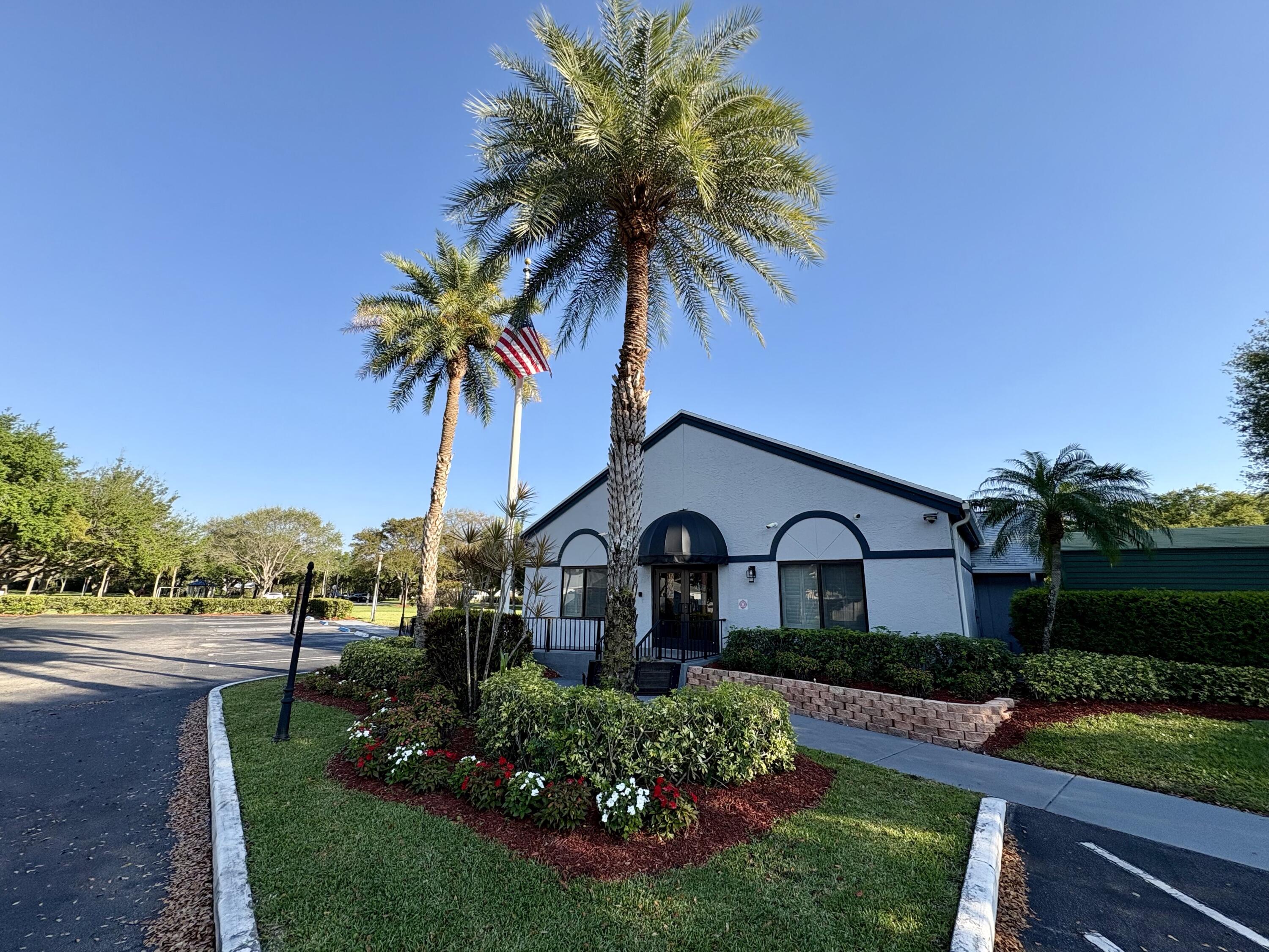 3 Kyle Way Boynton Beach, FL 33426 - Photo 35 of 36 a front view of a house with garden