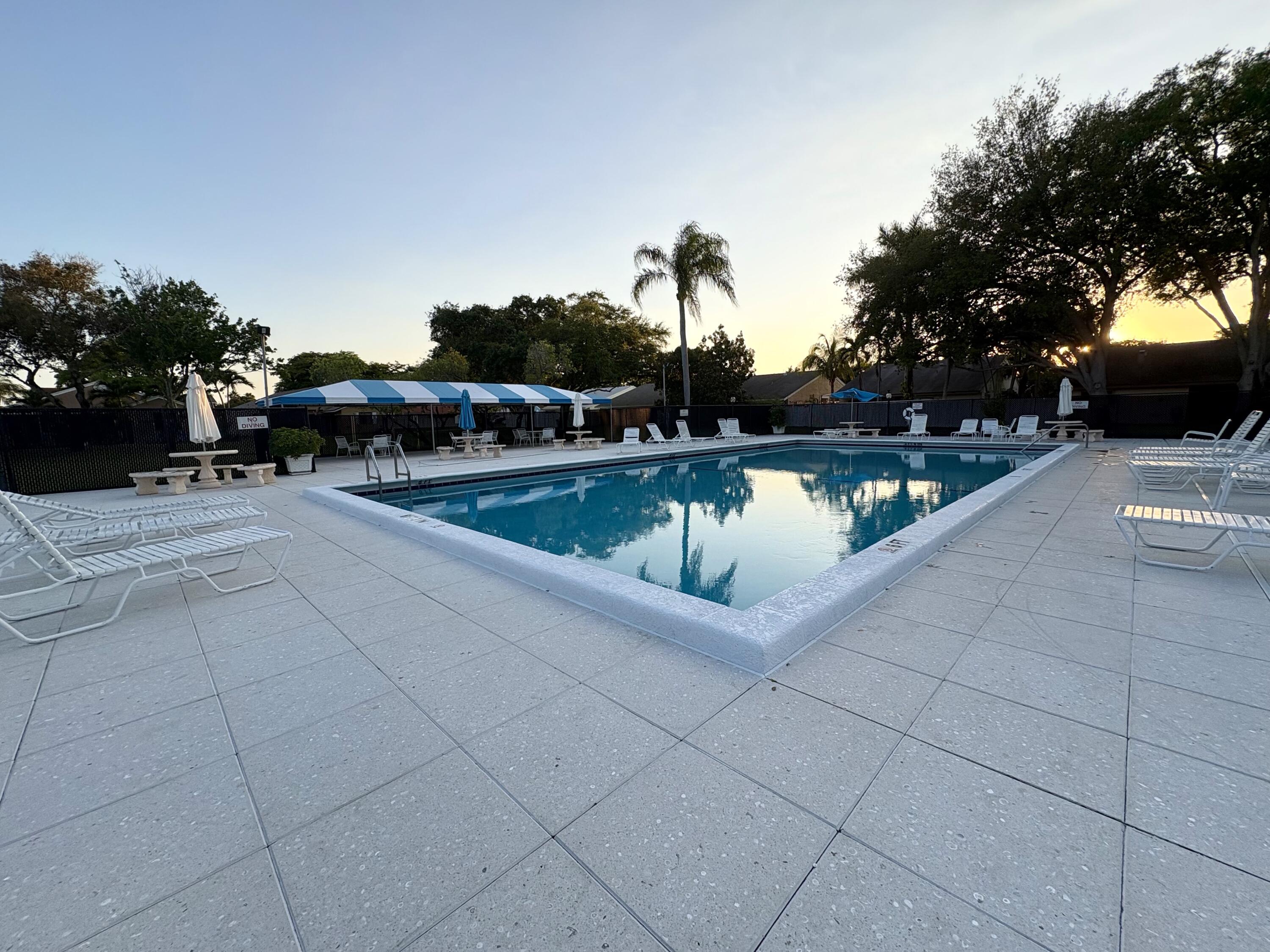 3 Kyle Way Boynton Beach, FL 33426 - Photo 36 of 36 a view of swimming pool with outdoor seating and plants