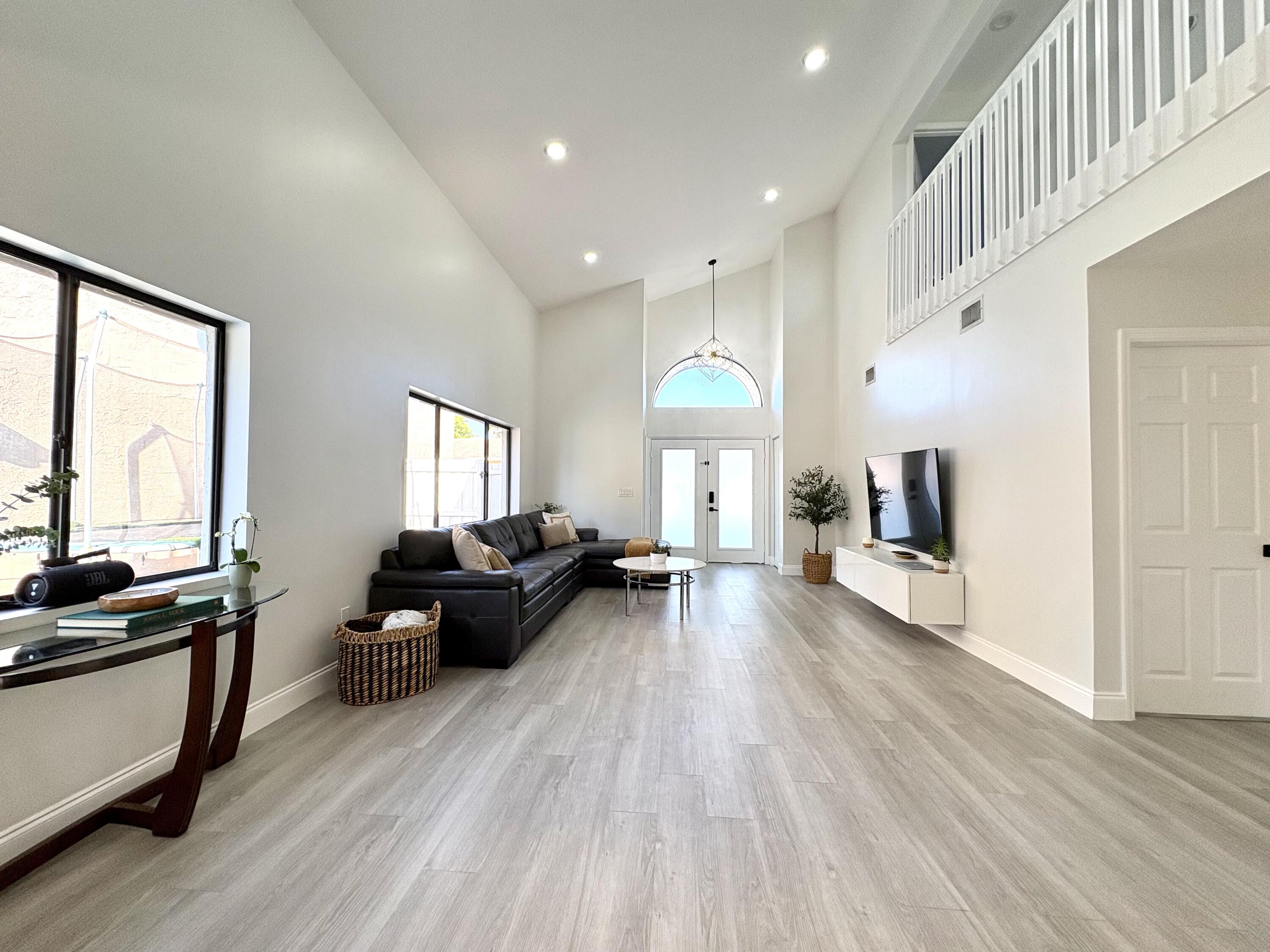 3 Kyle Way Boynton Beach, FL 33426 - Photo 4 of 36 a living room with fireplace furniture and a wooden floor