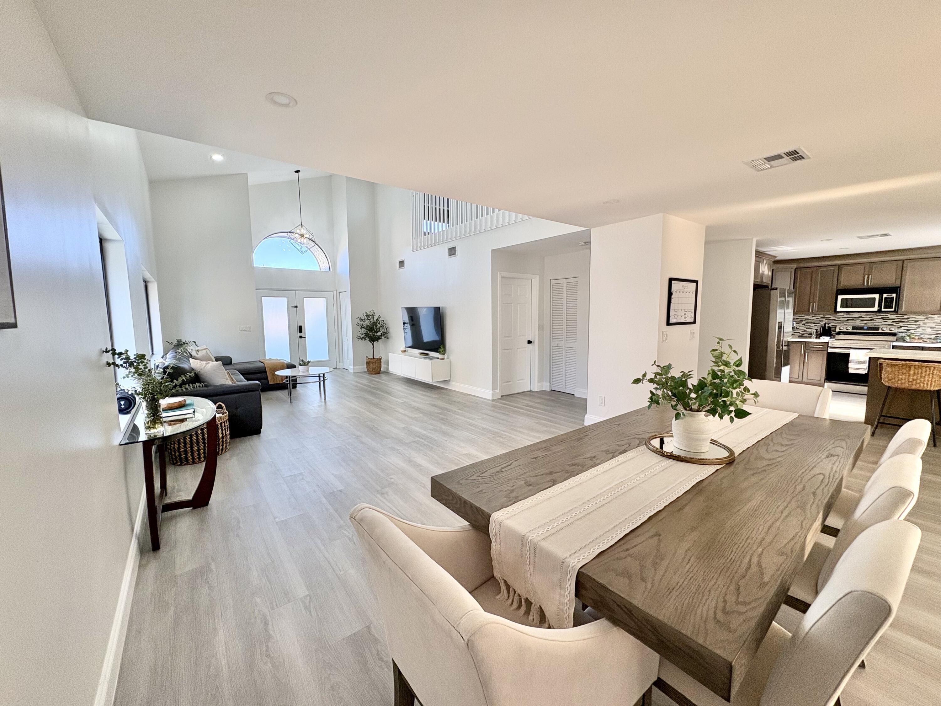 3 Kyle Way Boynton Beach, FL 33426 - Photo 6 of 36 a living room with fireplace furniture and a wooden floor