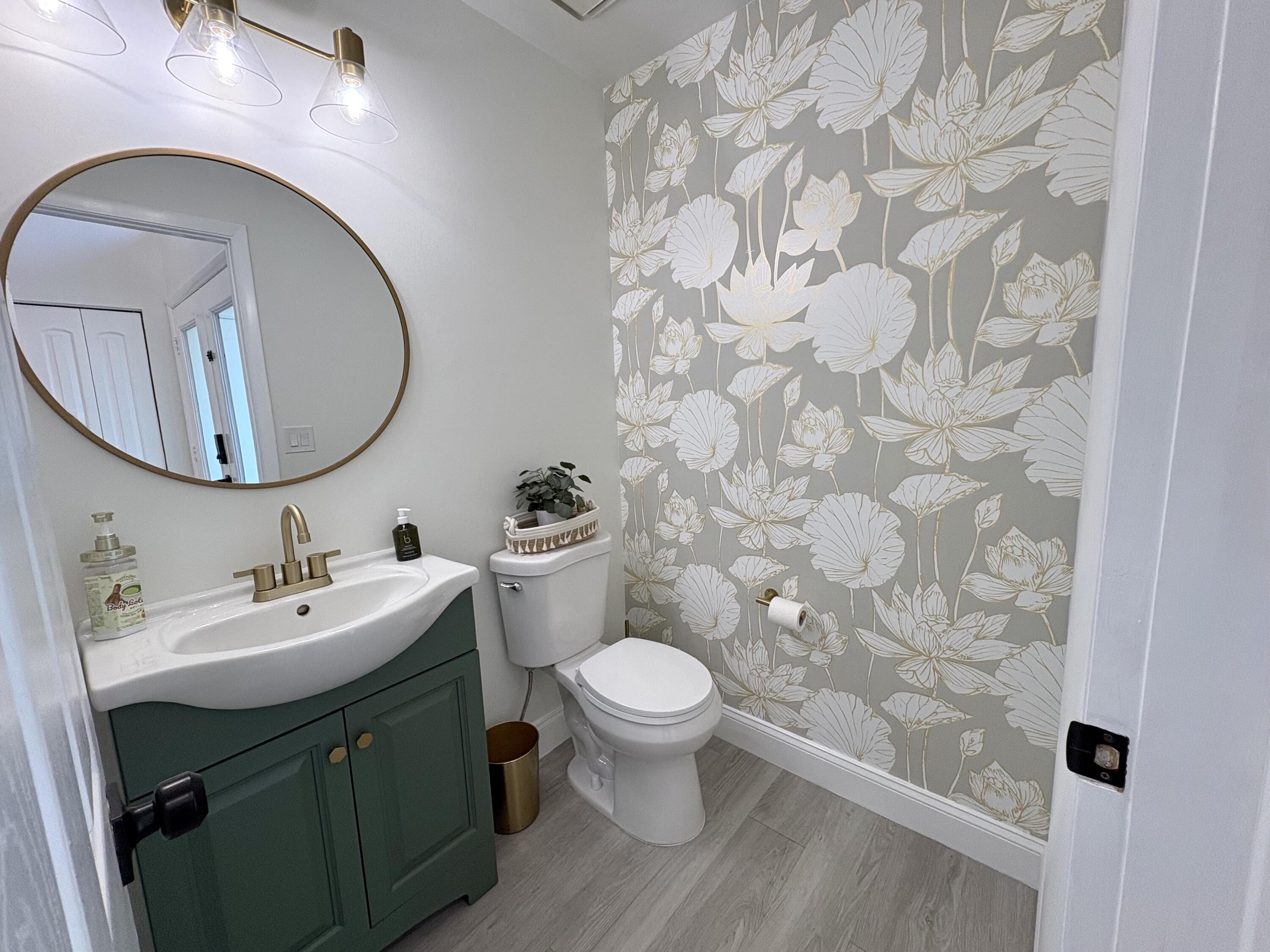3 Kyle Way Boynton Beach, FL 33426 - Photo 8 of 36 a bathroom with a toilet sink and mirror