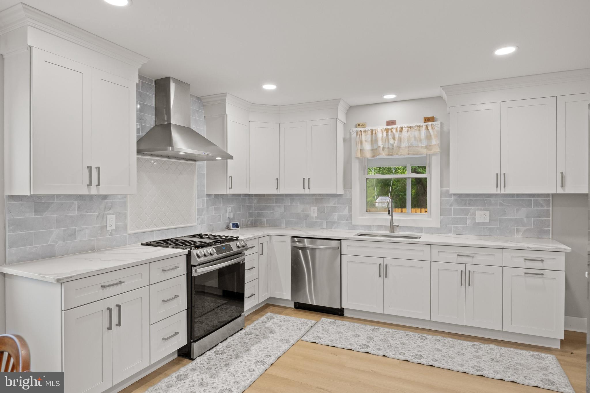 218 Pleasant Mills Road Hammonton, NJ 08037 - Photo 11 of 36 a kitchen with stainless steel appliances granite countertop a sink stove and cabinets