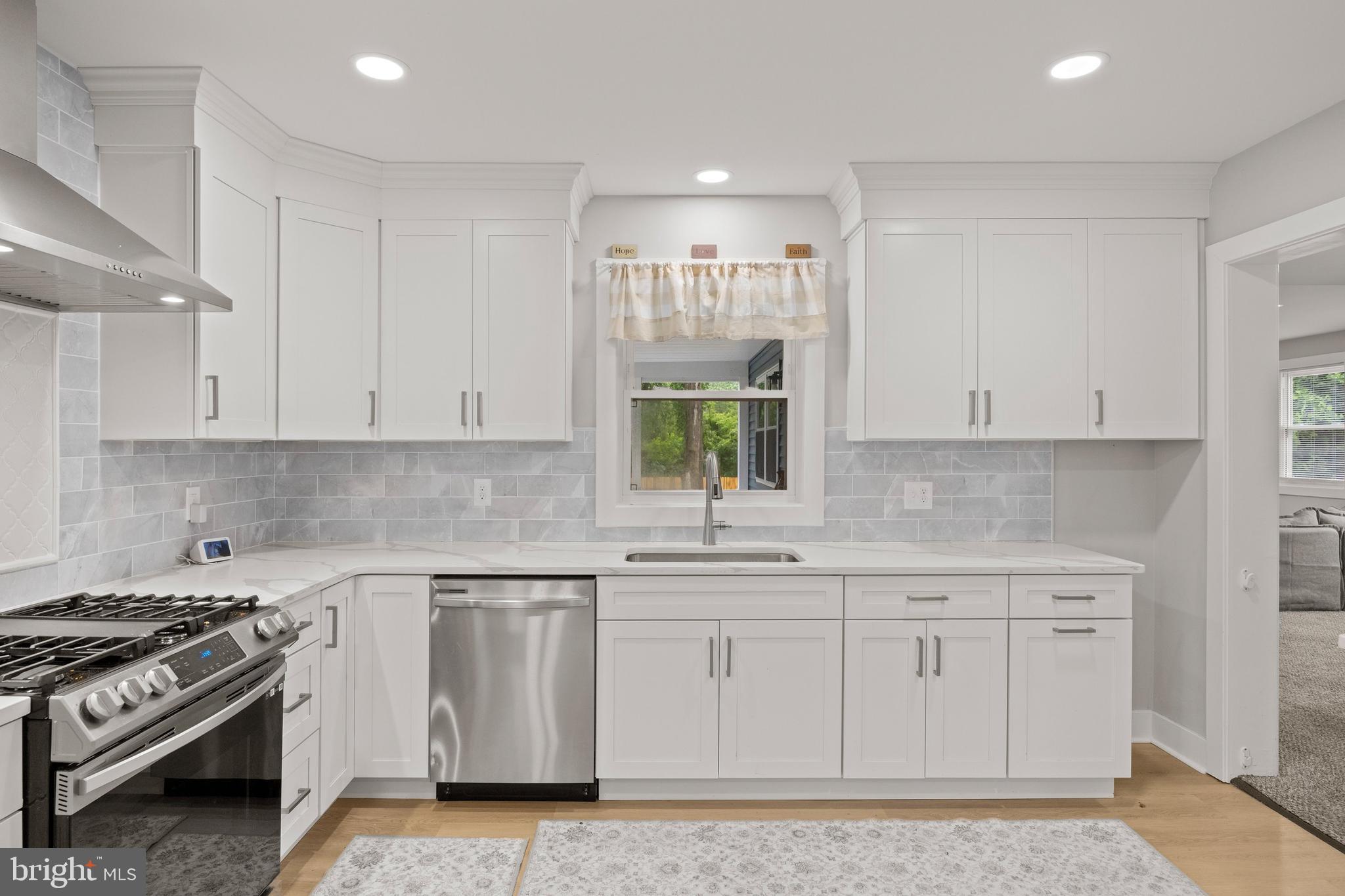 218 Pleasant Mills Road Hammonton, NJ 08037 - Photo 12 of 36 a kitchen with white cabinets and appliances