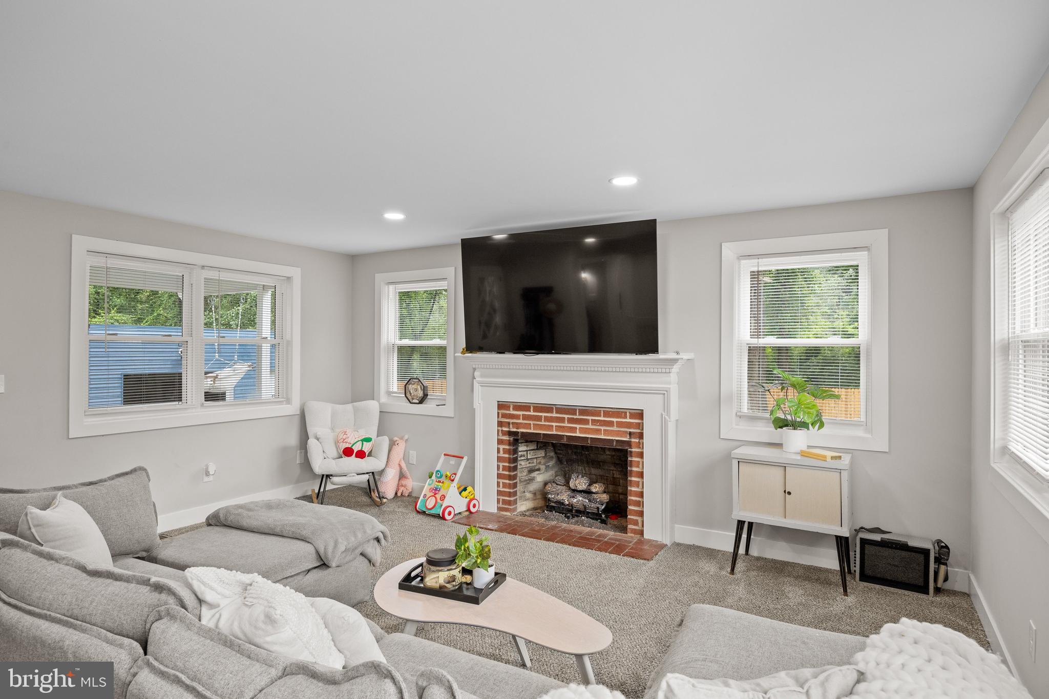 218 Pleasant Mills Road Hammonton, NJ 08037 - Photo 16 of 36 a living room with furniture and a fireplace