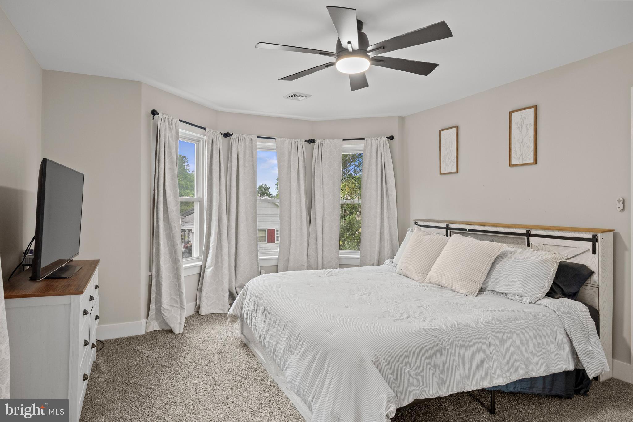 218 Pleasant Mills Road Hammonton, NJ 08037 - Photo 19 of 36 a bedroom with a large bed and a flat tv screen on dresser