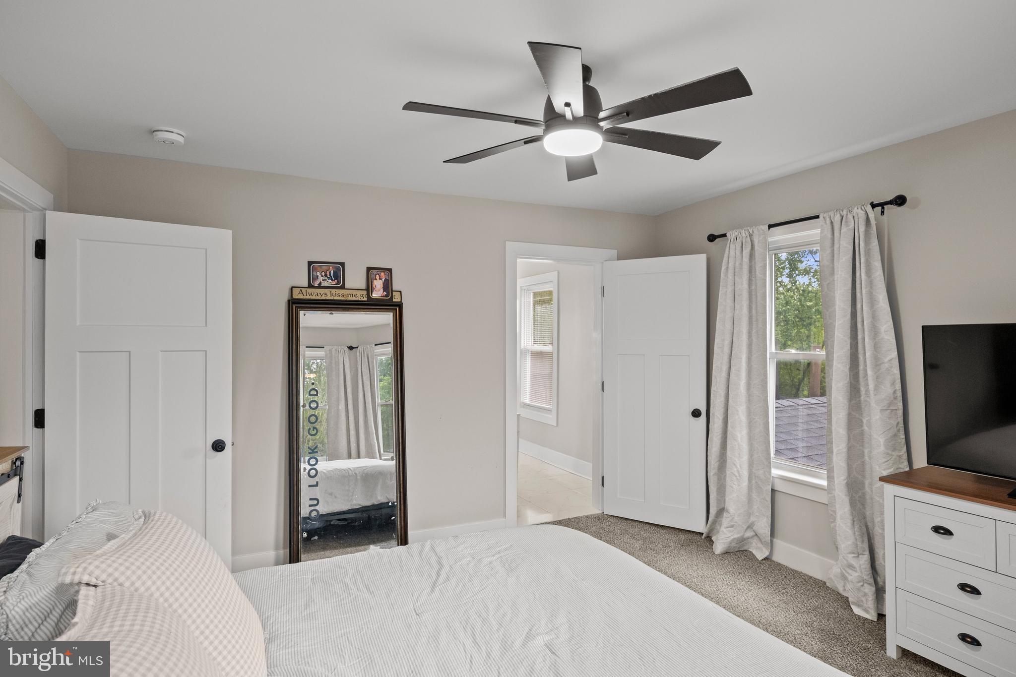 218 Pleasant Mills Road Hammonton, NJ 08037 - Photo 21 of 36 a bedroom with a bed and a flat tv screen on dresser