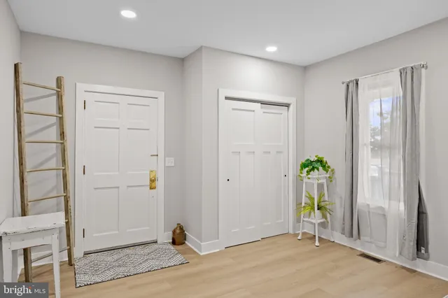 a view of an empty room and wooden floor
