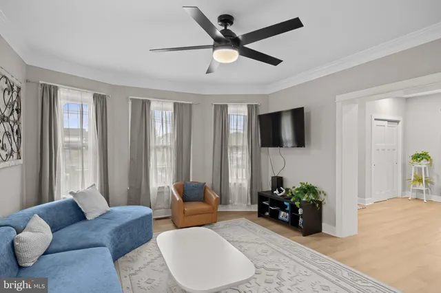 a living room with furniture or couch and a flat screen tv