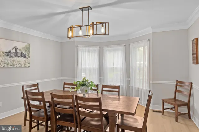 a view of a dining room with furniture and window