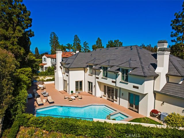 a view of a patio with swimming pool table and chairs