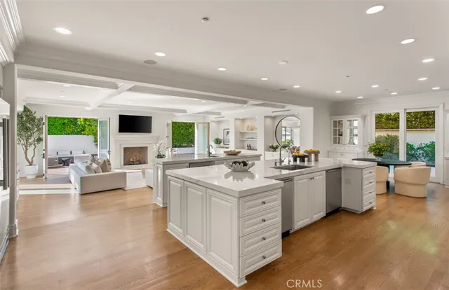 a living room with furniture and view of kitchen